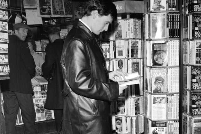 Rangers star Jim Baxter at Renfrew airport before boarding a flight to Vienna in December 1964. Picture: TSPL