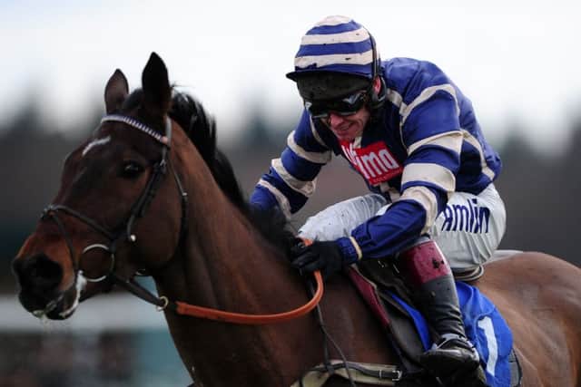 Midnight Prayer, ridden by Richard Johnson, jumps the last to win at Exeter. Picture: Harry Trump/Getty Images