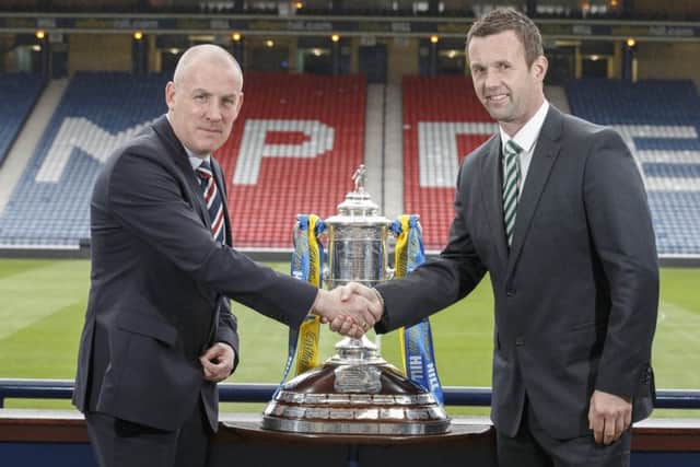 Rangers manager Mark Warburton (left) and Celtic manager Ronny Deila with the Scottish Cup at Hampden. Picture: Steve Welsh/William Hill/PA Wire