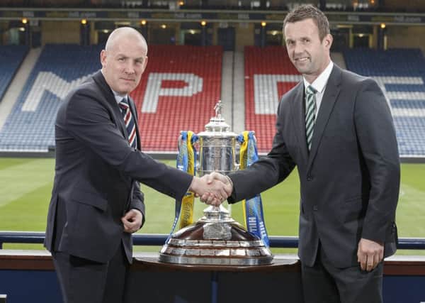 Rangers manager Mark Warburton (left) and Celtic manager Ronny Deila with the Scottish Cup at Hampden. Picture: Steve Welsh/William Hill/PA Wire