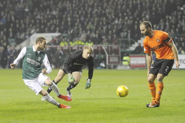 Martin Boyle and Sean Dillon face off in the League Cup match at Easter Road earlier this season. Picture: Greg Macvean