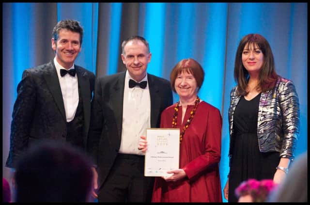 Anne Dick accepts her Lifetime Achievement honour with David Lee and Dougie  Vipond. Picture: Rob McDougall