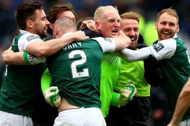 Conrad Logan of Hibernian is mobbed by teammates after winning the Scottish Cup semi-final. Picture: Getty Images