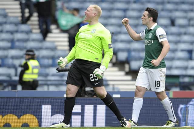 Hibs goalkeeper Conrad Logan celebrates with John McGinn. Picture: Neil Hanna