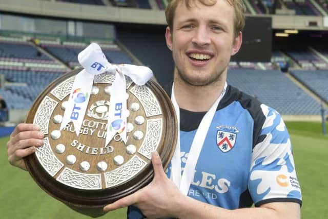 A victorious Carrick lift the BT Shield