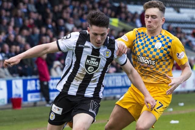 St Mirren's Lewis Morgan, left, is challenged by Mark Russell of Morton. Picture: Ross Parker/SNS