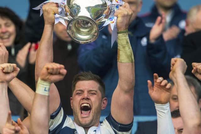 Heriots lift the trophy after Melrose were made to pay for their sins when players were yellow carded.  Picture: SNS