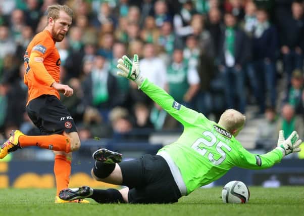 Hibs keeper Conrad Logan saves from Henri Anier of Dundee United. Picture: Ian MacNicol/Getty