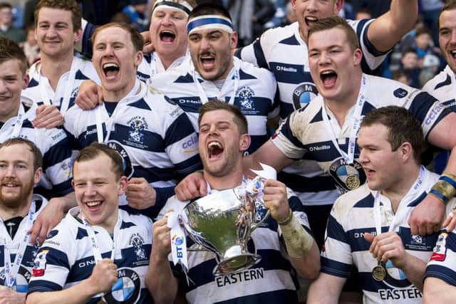 Heriots players celebrate winning the BT Cup final at Murrayfield on Saturday after they beat border rivals Melrose in a tense match. Picture: SNS