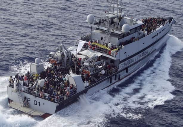 Rescued migrants are seen aboard this ship of the Italian border police in the Mediterranean last year but the mission has now ended. Picture: AP