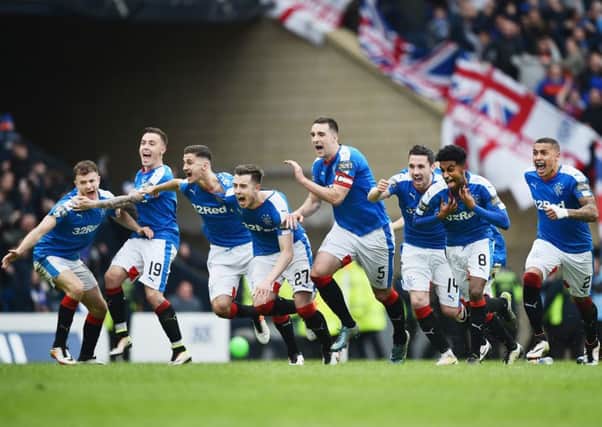 The Rangers team go wild after watching Tom Rogic miss his penalty, booking the Ibrox side's place in the final. Picture: Getty