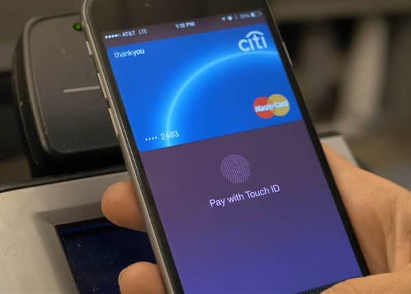 The Co-operative predicts contactless payments via mobile phones using software such as Apple Pay will outstrip cash within a decade. Picture: Apple/PA Wire