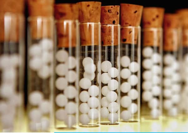 Vials containg pills for homeopathic remedies. (Photo by Peter Macdiarmid/Getty Images)