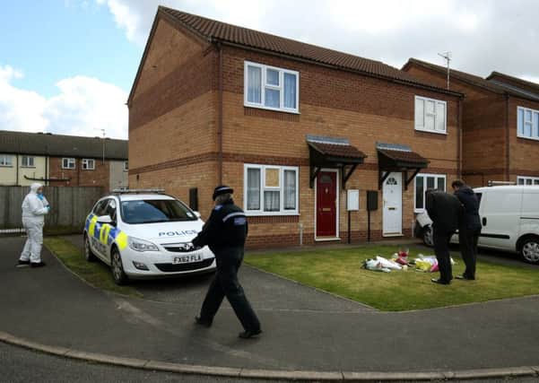 Police at the scene of the double murder. Picture: Chris Radburn/PA Wire