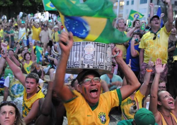 Activists supporting Dilma Rousseffs impeachment follow the action on big screens in Rio de Janeiro. Picture: AFP/Getty Images