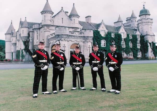 John Ross, centre, with colleagues at Balmoral Castle. Picture: contributed