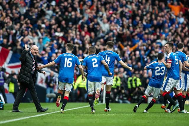 Rangers manager Mark Warburton, left, celebrates with his players at Hampden. Picture: John Devlin