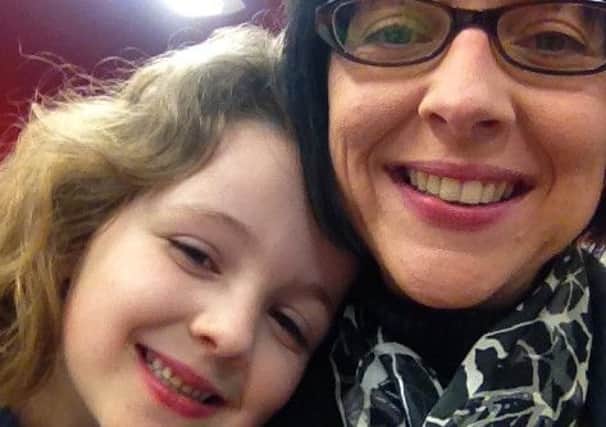 Sarah Anderson, Scottish legacy manager with Cancer Research UK, with daughter Em