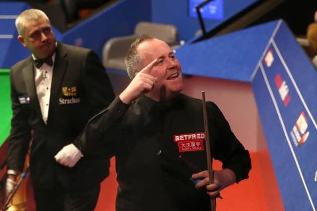John Higgins celebrates after his comprehensive first-round win over Ryan Day at The Crucible. Picture: PA