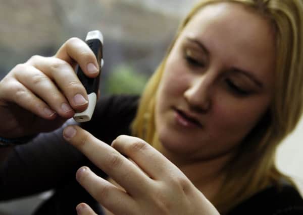 Type 1 diabetes sufferers such as Caroline Robb need to monitor their glucose levels regularly every day. Picture: Greg Macvean