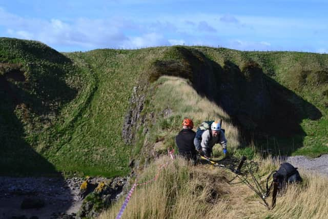 Dr Gordon Noble, head of archaeology at Aberdeen University, arrives on the top of Dunnicaer. Picture: Alison Campsie