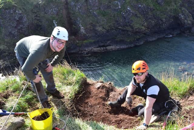 Michael Stratigos, PhD archaeology student, Aberdeen University is pictured left  with Duncan Paterson, of North East Mountaineering, who led the team up the sea stack using ropes and a fixed ladder. Picture:  Alison Campsie.