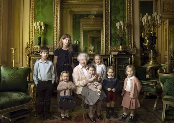 To mark her 90th, the Queen is photographed with her five great-grandchildren and two youngest grandchildren. Picture: PA