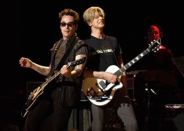 Earl Slick and David Bowie. Picture: KMazur/WireImage