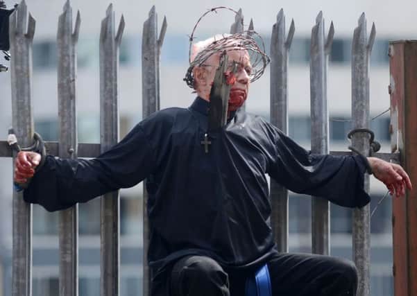 An actor portraying a zombie on the set of Zombie Apocalypse. Picture: SWNS