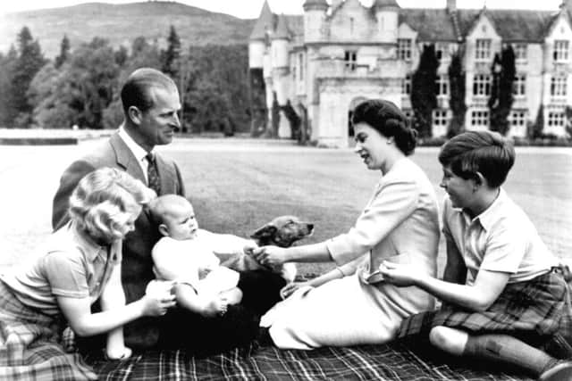 Members of the Royal Family playing with Prince Andrew in the grounds of Balmoral in 1960. Picture: PA