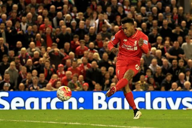 Substitute Daniel Sturridge scores Liverpools third goal  and his 50th for the club  as Jurgen Klopps men took the Merseyside derby honours at Anfield last night. Picture: PA