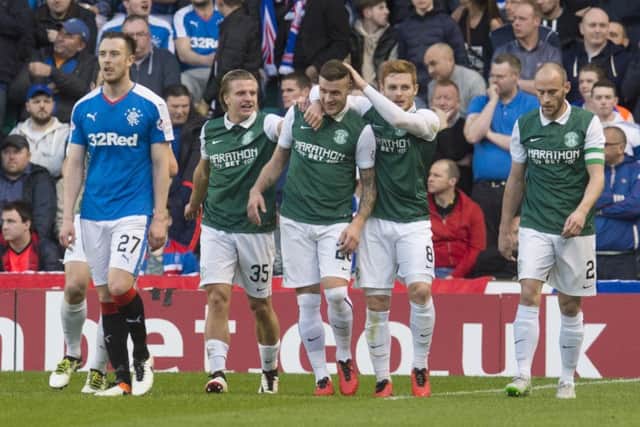 Anthony Stokes is congratulated after Wes Foderingham's error allowed Hibs to take a 2-0 lead. Picture: SNS