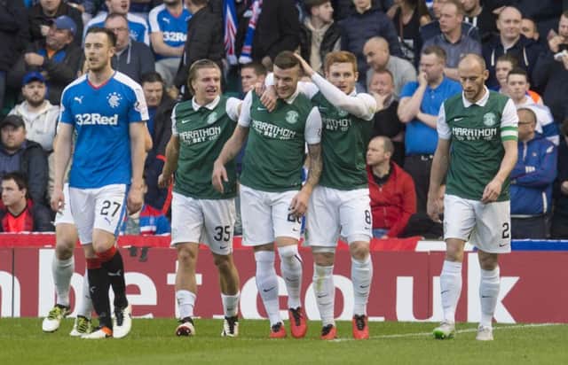 Anthony Stokes is congratulated after Wes Foderingham's error allowed Hibs to take a 2-0 lead. Picture: SNS
