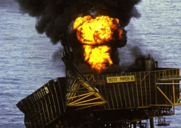 A fire burns on the North Sea oil rig Piper Alpha after an explosion July 1988 which killed more than 160 people