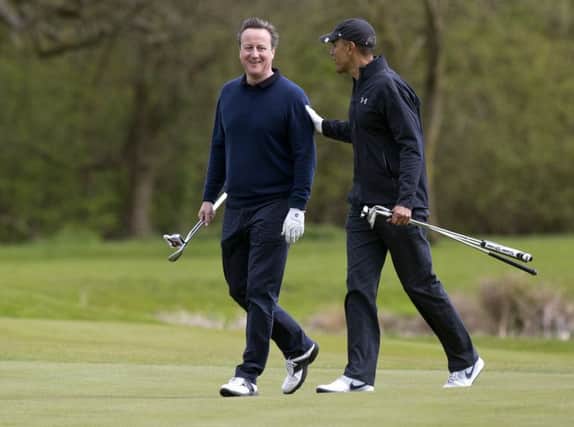 President Barack Obama and David Cameron play golf in Hertfordshire on Saturday. Picture: AP