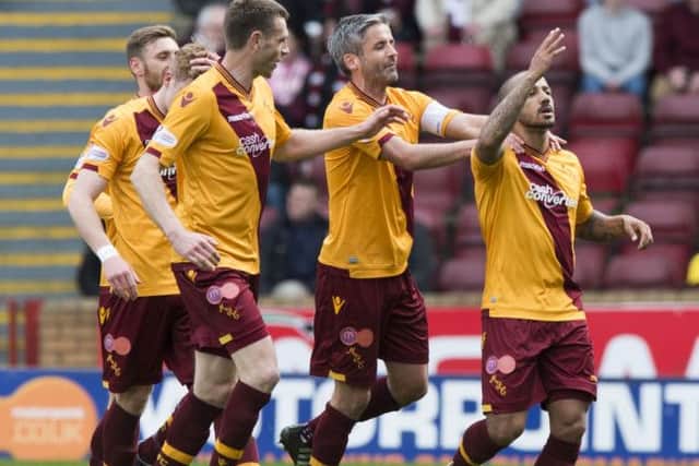 Motherwell's Lionel Ainsworth celebrates after making it 1-0. Picture: SNS