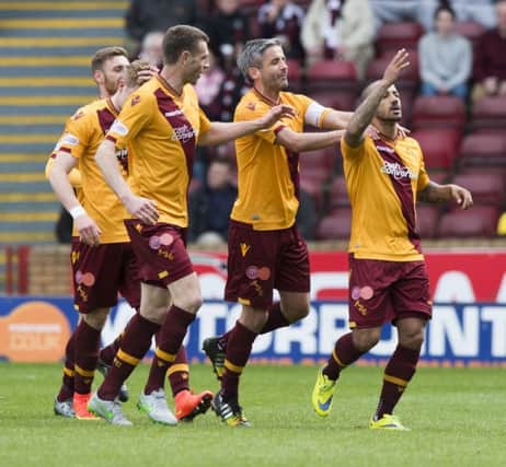 Motherwell's Lionel Ainsworth celebrates after making it 1-0. Picture: SNS
