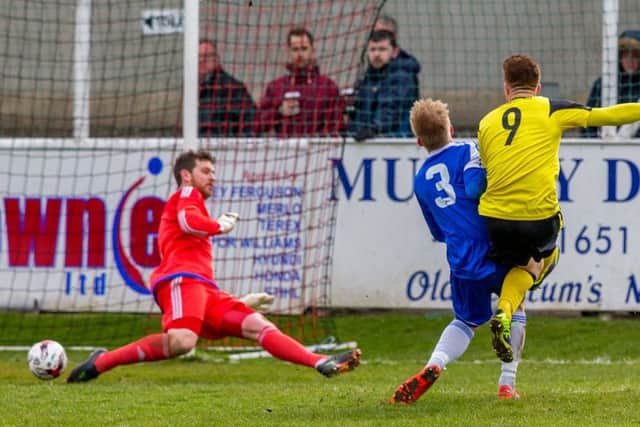 Edinburgh City's Ross Allum makes it 3-0 against Cove. Picture: Jasperimage