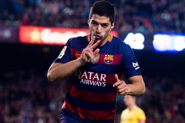 Luis Suarez celebrates after scoring Barcelona's sixth goal against Sporting Gijon. Picture: Alex Caparros/Getty Images