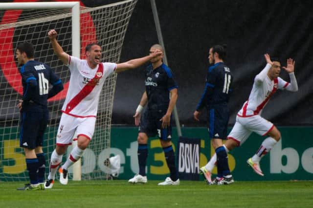 Rayo Vallecano's ex-Celtic forward Miku, right, celebrates his goal against Real Madrid. Picture: AFP/Getty Images
