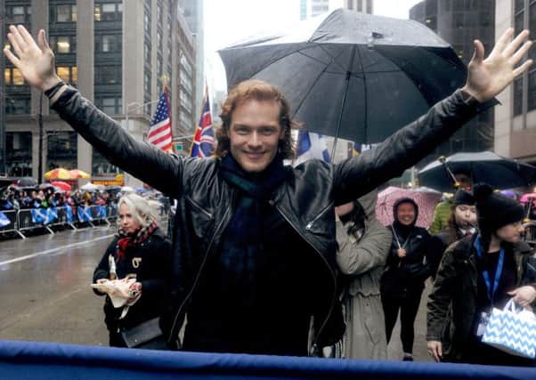 The scarf Sam was wearing raised over Â£10,000 for charity Picture: NY Tartan Week