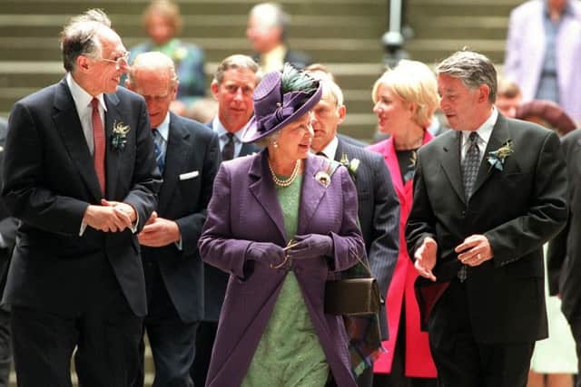 The Queen, Sir David Steel and Donald Dewar emerge in the courtyard after the opening ceremony of the Scottish Parliament
