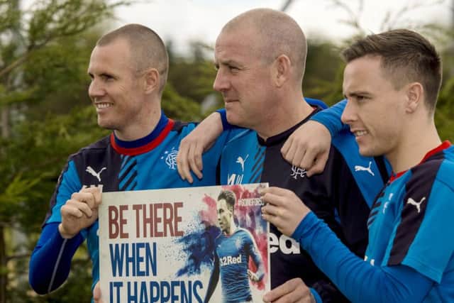 Rangers manager Mark Warburton, centre, with Kenny Miller, left, and Barrie McKay promote Rangers 2016/17 season tickets going on sale. Picture: Craig Williamson/SNS