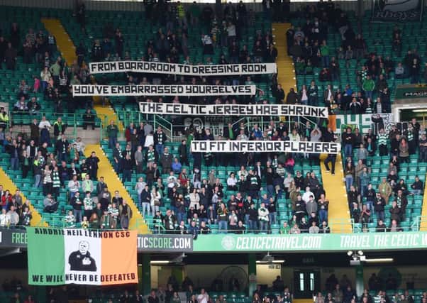 Celtic fans display a banner during the club's 1-1 draw with Ross County. Picture: SNS