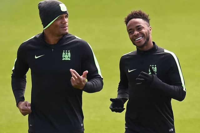 Vincent Kompany, left, trains with Raheem Sterling yesterday as they prepare to face Real Madrid. Picture: AFP/Getty