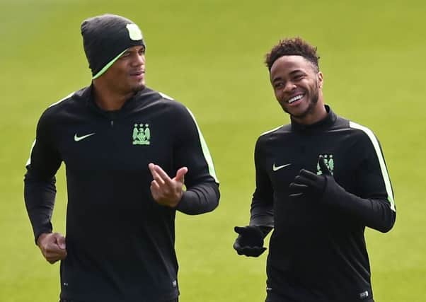 Vincent Kompany, left, trains with Raheem Sterling yesterday as they prepare to face Real Madrid. Picture: AFP/Getty