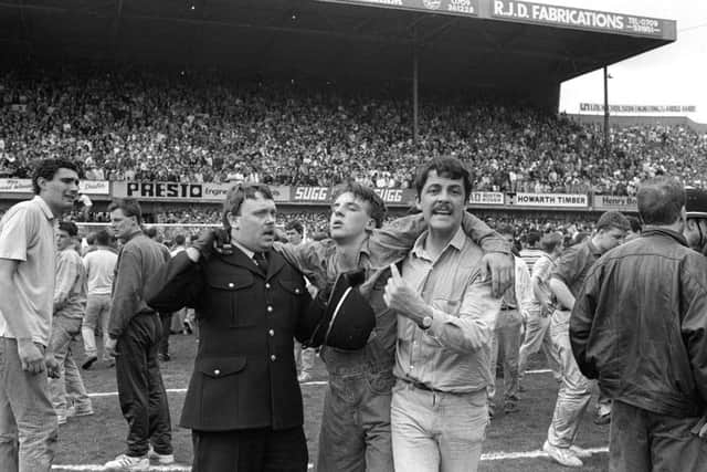 Injured fan recieving medical attention on the pitch at Hillsborough. Picture: PA
