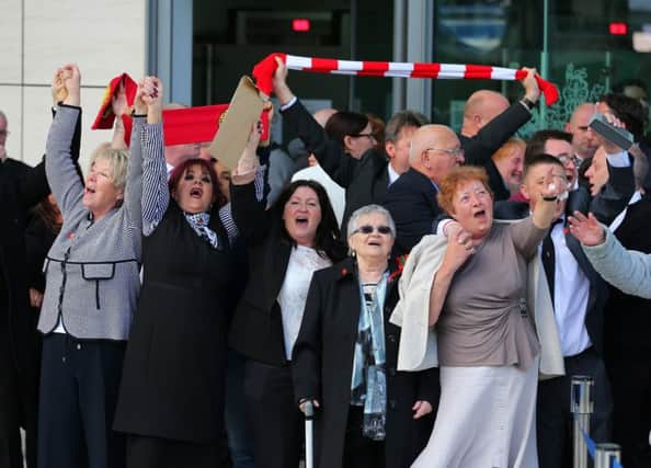 Relatives of the Hillsborough sing 'You'll never walk alone' as they depart Birchwood Park after hearing the conclusions of the Hillsborough inquest. Picture: Getty