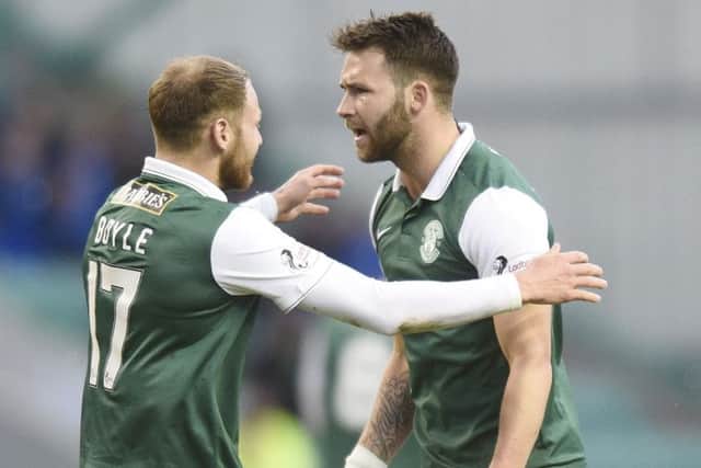 Hibs hat-trick hero James Keatings, right, celebrates his second goal with Martin Boyle. Picture: Greg Macvean