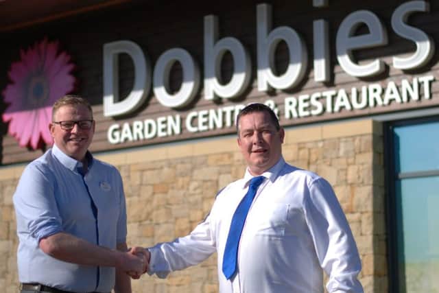 John Paterson, general manager at Dobbies Braehead, left, with John Nelson of DM Design. Picture: Contributed
